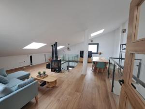 a living room with a couch and a fireplace at Ayra de Gredos in El Barco de Ávila