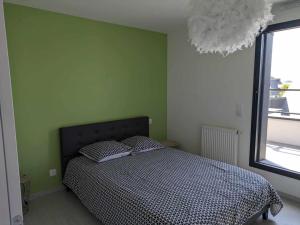 Postel nebo postele na pokoji v ubytování Chez Gaëlle