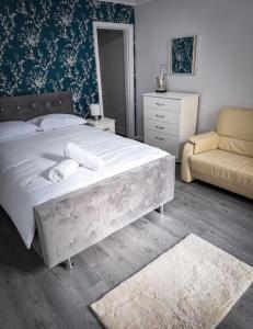 Postel nebo postele na pokoji v ubytování DownTown Delight 2