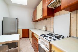 Kuchyňa alebo kuchynka v ubytovaní Victus Apartamenty, Apartament Fala Bałtyku