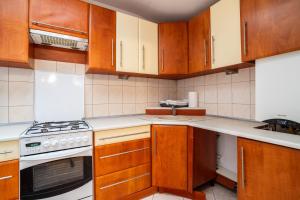 Kuchyňa alebo kuchynka v ubytovaní Victus Apartamenty, Apartament Fala Bałtyku
