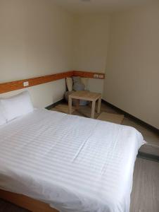 Postel nebo postele na pokoji v ubytování 慢且洄瀾文旅 Bantshiann Hualie Hotel