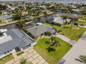 an aerial view of a house with a yard at Gulf Breeze Haven Direct Gulf Access Pool+Dock in Cape Coral