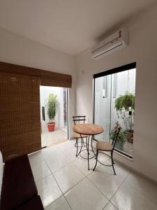 a dining room with a table and chairs in a room at La Fluorita Hospedaria in Morro do Chapéu +8 photos