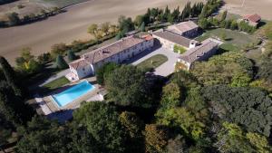 an aerial view of a house with a swimming pool at La Ginelle - Appartement Guy in Airoux