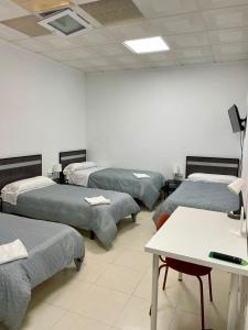 Postel nebo postele na pokoji v ubytování Hostal Kaizen