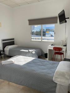 Postel nebo postele na pokoji v ubytování Hostal Kaizen
