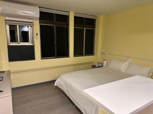 Postel nebo postele na pokoji v ubytování 慢且洄瀾文旅 Bantshiann Hualie Hotel