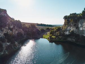 an aerial view of a body of water between two cliffs at Agriturismo Morani in Santa Severa