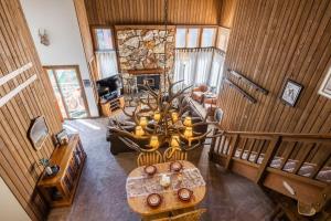 an overhead view of a living room with a chandelier at Mountainback 19 Loft Den in Mammoth Lakes