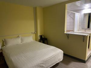 Postel nebo postele na pokoji v ubytování 慢且洄瀾文旅 Bantshiann Hualie Hotel