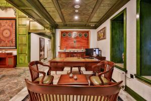 a dining room with a wooden table and chairs at Emerald Mansion Hotel - Special Category in Istanbul
