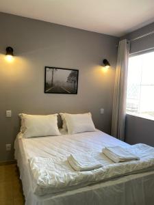 En eller flere senge i et værelse på Apto 2 ao lado da UFOP e garagem + 4 billeder