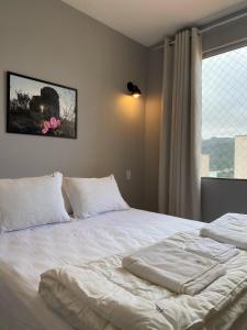 En eller flere senge i et værelse på Apto 2 ao lado da UFOP e garagem