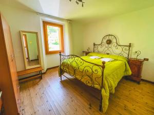 Rúm í herbergi á B&B Il Paradiso Mozzio