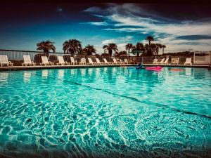 Bazén v ubytování SandyToes B Beach bikes pool & Fun nebo v jeho okolí