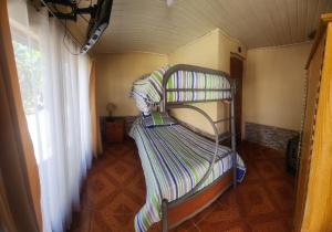 two bunk beds in a room with a window at Hospedaje Shuyen in Victoria +40 photos