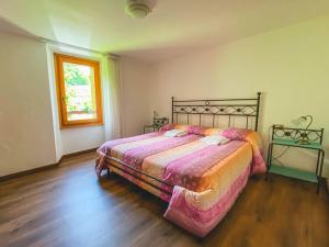 Rúm í herbergi á B&B Il Paradiso Mozzio
