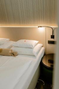 Postel nebo postele na pokoji v ubytování Hotel Erzherzog Rainer