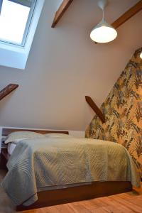 Postel nebo postele na pokoji v ubytování Apartmány pod Prašivou