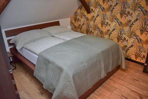 Postel nebo postele na pokoji v ubytování Apartmány pod Prašivou