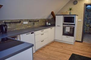 Kuchyň nebo kuchyňský kout v ubytování Apartmány pod Prašivou