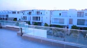 a view of a building from the roof of a building at Fully furnished Townhouse in Abū Rawwāsh