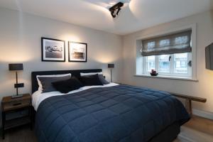 En eller flere senge i et værelse på Hausteil Üüs Droom Hüs, Tinnum, Sylt