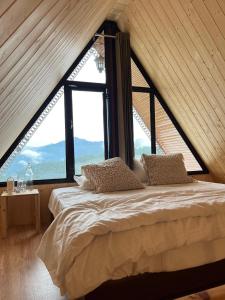 Ένα ή περισσότερα κρεβάτια σε δωμάτιο στο Khoj The Lake Trail