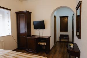 TV a/nebo společenská místnost v ubytování Hotel Claudiu