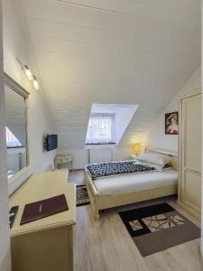 Postel nebo postele na pokoji v ubytování Hotel Claudiu