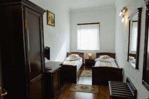 Postel nebo postele na pokoji v ubytování Hotel Claudiu