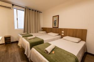 Cama ou camas em um quarto em Hotel Golden Star