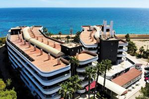 an aerial view of a building by the ocean at Palmera Beach in Pilar de la Horadada