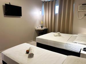 Postel nebo postele na pokoji v ubytování Hotel Econotel by Bsb Inn