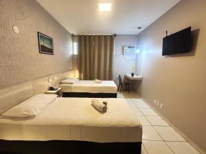 Postel nebo postele na pokoji v ubytování Hotel Econotel by Bsb Inn