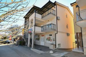 a building on the side of a street at Apartment Dijana with private pool in Donji Proložac