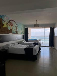 Ένα ή περισσότερα κρεβάτια σε δωμάτιο στο Mochican Palace Hotel