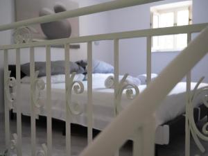 Ένα ή περισσότερα κρεβάτια σε δωμάτιο στο HYDRA Suite