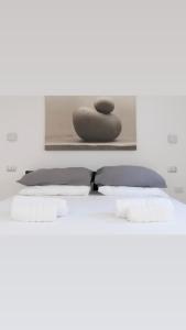 Ένα ή περισσότερα κρεβάτια σε δωμάτιο στο HYDRA Suite