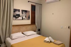Ένα ή περισσότερα κρεβάτια σε δωμάτιο στο Cardeiro Flat +183 φωτογραφίες
