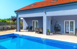 a house with a swimming pool in front of it at 6 Bedroom Amazing Home In Bilice in Bilice +49 photos