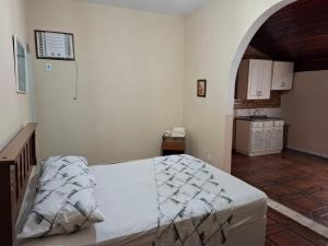Ένα ή περισσότερα κρεβάτια σε δωμάτιο στο Casa Pouso Muriqui