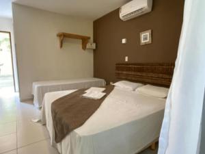 Postel nebo postele na pokoji v ubytování Nova Costeira da Barra + 50 fotografií