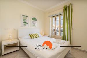 Ένα ή περισσότερα κρεβάτια σε δωμάτιο στο #274 Pedra dos Bicos T by Home Holidays