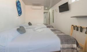 Cama ou camas em um quarto em Hotel Las Lunas