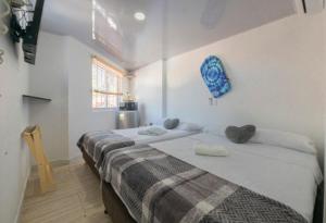 Cama ou camas em um quarto em Hotel Las Lunas