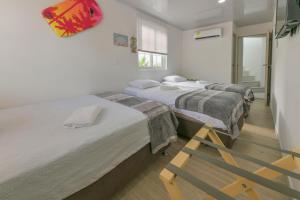 Cama ou camas em um quarto em Hotel Las Lunas