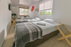 Cama ou camas em um quarto em Hotel Las Lunas
