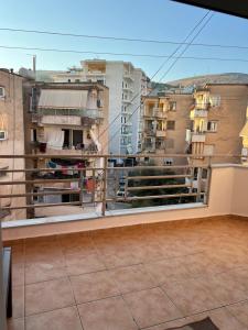 a balcony with a view of some buildings at Saranda Spot Apartment in Sarandë